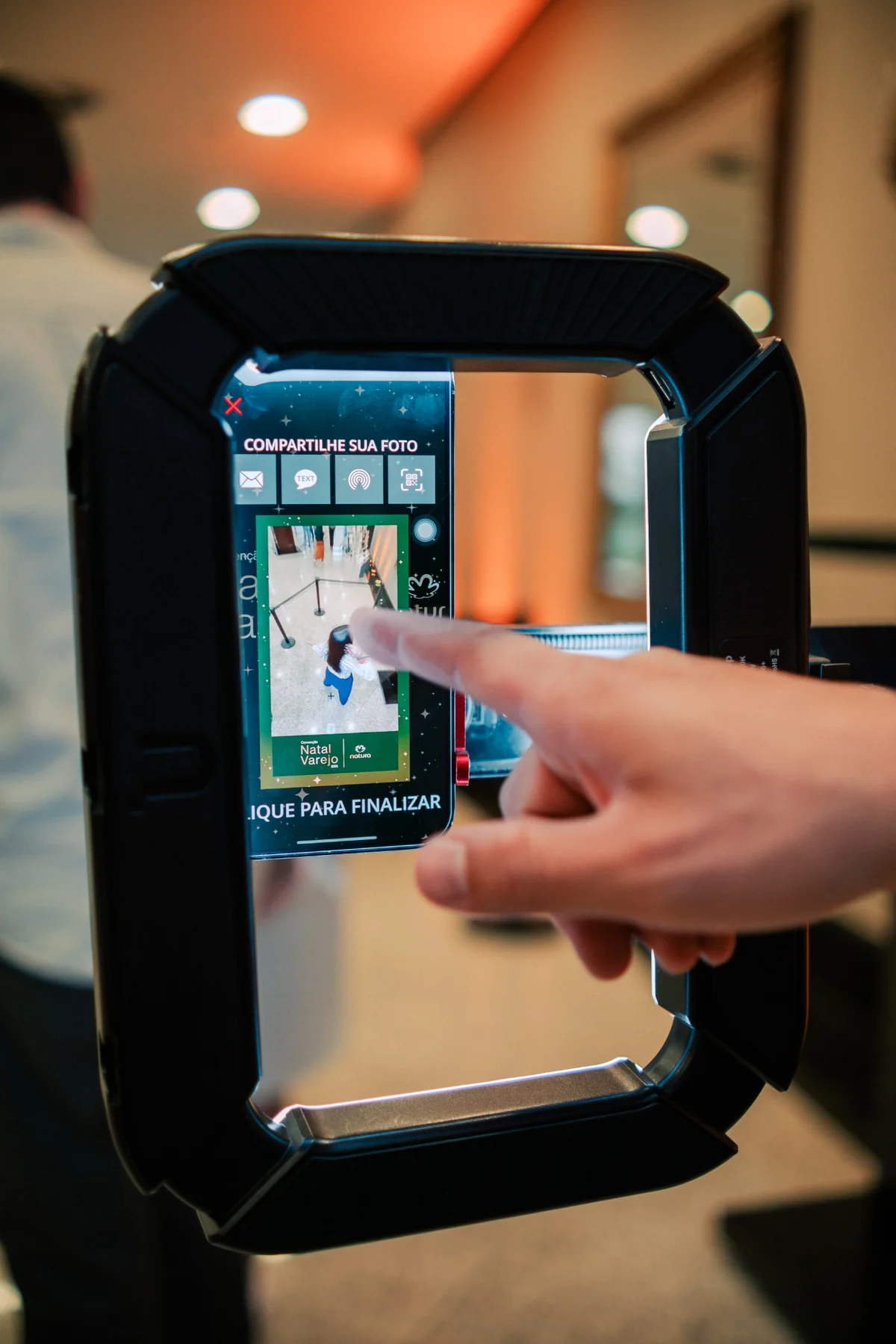 Guest accessing branded content on the event sharing station