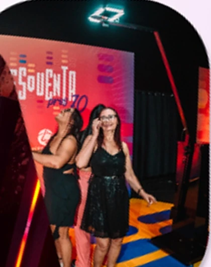 Two guests posing at a branded event activation